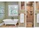 Elegant bathroom featuring a freestanding tub, walk-in shower, and classic fixtures at 391 Evian Way, Mount Pleasant, SC 29464