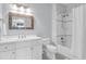 Bathroom featuring a single sink white vanity, decorative mirror, toilet and a shower and tub combination at 391 Evian Way, Mount Pleasant, SC 29464