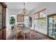 Bright dining room showcasing a chandelier, a rug, and natural light at 391 Evian Way, Mount Pleasant, SC 29464