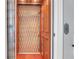 Interior view of an elevator featuring wood paneling and a metal safety gate at 391 Evian Way, Mount Pleasant, SC 29464