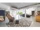 Spacious garage with a covered car, a wicker rocking chair with a leaf patterned rug at 391 Evian Way, Mount Pleasant, SC 29464