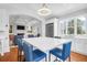 Bright kitchen featuring a large island with seating, stainless steel appliances, and an open layout to the living area at 391 Evian Way, Mount Pleasant, SC 29464