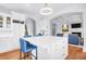 Open kitchen with an island, seating, and seamless transition to the living area at 391 Evian Way, Mount Pleasant, SC 29464