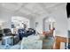 Open living room featuring modern furniture, a coffered ceiling, and an open-concept layout at 391 Evian Way, Mount Pleasant, SC 29464