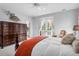 Comfortable bedroom with french doors and a decorative armoire at 391 Evian Way, Mount Pleasant, SC 29464
