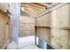 Outdoor shower with a wooden plank floor and walls and a view of the landscape beyond at 391 Evian Way, Mount Pleasant, SC 29464