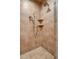 Walk-in shower with tiled walls, rain shower head and corner shelves at 391 Evian Way, Mount Pleasant, SC 29464