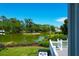 Relaxing water view from the back deck with lush greenery surrounding the pond at 391 Evian Way, Mount Pleasant, SC 29464