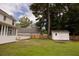 Lush backyard featuring a shed, wooden fence, and a well-maintained lawn with a two-story home at 407 Thomaston Ave, Summerville, SC 29485