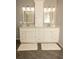 Bathroom with double vanity, white cabinets, grey walls, and modern fixtures at 407 Thomaston Ave, Summerville, SC 29485