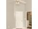 Bright bedroom featuring neutral walls, modern ceiling fan, and white door at 407 Thomaston Ave, Summerville, SC 29485