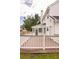 Wooden deck with white railings, next to the screened in porch and a white siding two-story home at 407 Thomaston Ave, Summerville, SC 29485