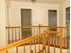 Hallway with railing and multiple doors leading to different rooms at 407 Thomaston Ave, Summerville, SC 29485