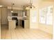 This kitchen includes stainless steel appliances, gray cabinets and an island for extra counter space at 407 Thomaston Ave, Summerville, SC 29485