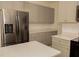 Modern kitchen with stainless steel appliances, gray cabinetry, and a bright, functional layout at 407 Thomaston Ave, Summerville, SC 29485