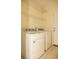 A laundry room with a washer and dryer and white wire shelving for storage at 407 Thomaston Ave, Summerville, SC 29485