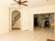 Open-concept living area featuring tile flooring, staircase access, and a view into the modern kitchen at 407 Thomaston Ave, Summerville, SC 29485