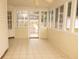 Bright sunroom featuring neutral walls, tiled floor, and ample windows offering plenty of natural light at 407 Thomaston Ave, Summerville, SC 29485
