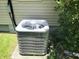 Exterior ground-level air conditioning unit in a residential yard with lush green foliage at 4457 Rice Mill Dr, North Charleston, SC 29420
