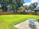 Large backyard featuring a patio set and a green lawn at 4457 Rice Mill Dr, North Charleston, SC 29420