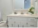 Bathroom with white vanity, a decorative mirror, and a toilet at 4457 Rice Mill Dr, North Charleston, SC 29420
