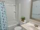 Bathroom with a vanity, toilet, and a shower/tub with blue patterned curtain at 4457 Rice Mill Dr, North Charleston, SC 29420