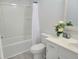Bathroom with a toilet, bathtub with shower, white vanity, and decorative mirror at 4457 Rice Mill Dr, North Charleston, SC 29420