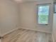 Bedroom with light wood floors and a bright window at 4457 Rice Mill Dr, North Charleston, SC 29420