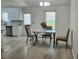 Cozy dining area with a table and chairs, flooded with natural light, perfect for enjoying meals at 4457 Rice Mill Dr, North Charleston, SC 29420