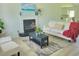 Bright living room featuring a fireplace, comfortable seating, and stylish decor, creating a cozy ambiance at 4457 Rice Mill Dr, North Charleston, SC 29420