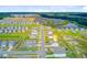 Aerial view of a vibrant community surrounded by a lake and lush greenery, highlighting the neighborhood's prime location at 494 Pender Woods Dr, Summerville, SC 29486
