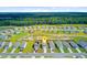 Neighborhood aerial showcasing the location of the house nestled within a community surrounded by lush forest and a pond at 494 Pender Woods Dr, Summerville, SC 29486