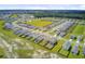 Aerial view of a Gathering-friendly community, showcasing its layout and proximity to recreational areas including a lake and playground at 494 Pender Woods Dr, Summerville, SC 29486