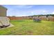 Well-maintained backyard with lush green grass, a concrete patio, and a dining set, ideal for outdoor relaxation at 494 Pender Woods Dr, Summerville, SC 29486