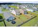 Aerial view of fenced backyards featuring hammocks, trampolines, and outdoor play areas at 494 Pender Woods Dr, Summerville, SC 29486
