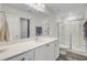 Bathroom featuring a double vanity sink, a large mirror and a glass shower enclosure at 494 Pender Woods Dr, Summerville, SC 29486