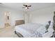 Spacious bedroom with carpet, ceiling fan, closet, dresser, and a full size bed with built in bookshelf headboard at 494 Pender Woods Dr, Summerville, SC 29486