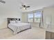 Spacious bedroom with carpet, ceiling fan, large windows and a full size bed with built in bookshelf headboard at 494 Pender Woods Dr, Summerville, SC 29486