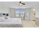 Spacious bedroom with carpet, ceiling fan, large windows and a full size bed with built in bookshelf headboard at 494 Pender Woods Dr, Summerville, SC 29486