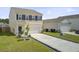 Well-kept two-story home featuring a long driveway, manicured lawn, and traditional design elements at 494 Pender Woods Dr, Summerville, SC 29486