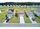 A view of three homes, each with attached garages and well-maintained lawns at 494 Pender Woods Dr, Summerville, SC 29486