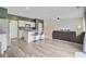 Spacious kitchen with stainless steel appliances and an open floor plan that connects to the living room at 494 Pender Woods Dr, Summerville, SC 29486