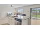 Open floor plan with a kitchen island that features a stainless steel dishwasher at 494 Pender Woods Dr, Summerville, SC 29486