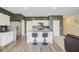 Modern kitchen with white cabinetry, granite countertops, and stainless steel appliances at 494 Pender Woods Dr, Summerville, SC 29486