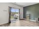 An open living area with patio access, lots of natural light, and nice flooring at 494 Pender Woods Dr, Summerville, SC 29486