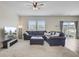 Comfortable living room with a large sectional, ceiling fan, and ample natural light at 494 Pender Woods Dr, Summerville, SC 29486