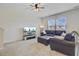 Bright living room with a spacious layout, plush carpet, and a comfortable leather sectional sofa at 494 Pender Woods Dr, Summerville, SC 29486