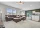 Open-concept living area featuring a large sofa, ceiling fan, and seamless flow to the kitchen at 494 Pender Woods Dr, Summerville, SC 29486