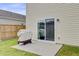 Back patio featuring a sliding glass door, grill, and views of the large back yard at 494 Pender Woods Dr, Summerville, SC 29486