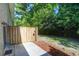 Outdoor patio area featuring a wood fence and access to a lush, green backyard space at 507 Stinson Dr # 4G, Charleston, SC 29407